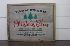 a wooden sign that says farm fresh christmas trees