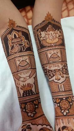 two hands with hendi designs on them