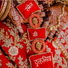 red and gold bridals with henna on display