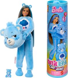 a blue teddy bear is next to a barbie doll and a tube with the same product on it