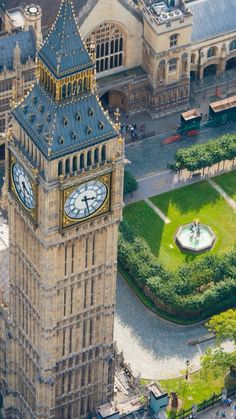 the big ben clock tower towering over the city of london in england, seen from above