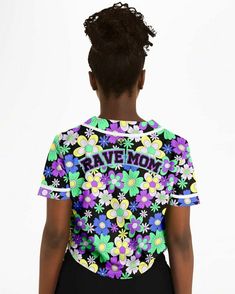 the back of a woman's t - shirt with flowers and words on it