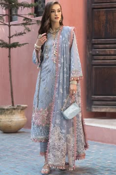 Elegant Ice Blue Heavily Embroidered Pakistani Salwar Kameez Dupatta Suit is a stunning attire that will give you an ethnic look on the big day. Premium quality fabric and lavish designs on this masterpiece make it the epitome of beauty and your foremost priority. Pakistani Kameez: The salwar kameez has an alluring ice blue color and it is emblazoned with embroidery and threads. The front of this purple kameez is intricately adorned with graceful designs, making it a perfect choice to wear on th Girls Attire, Kameez Designs, Pakistani Salwar, Dress Salwar Kameez, Pakistani Fancy Dresses, Pakistani Salwar Kameez, Desi Clothes, Pakistani Wedding Dresses, Salwar Kameez Designs