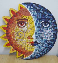 the sun and moon are made out of mosaic tiles