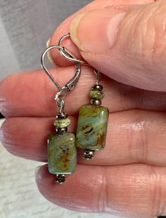 These handmade Czech glass and Jasper earrings are a  milky green with swirls of light and dark brown. I've accented them with pewter beads.  The earrings are 1.5  inches long.  All purchases come in a gift box or gift bag. Unique Hypoallergenic Drop Earrings, Unique Hypoallergenic Adjustable Earrings, Nickel-free Drop Earrings For Jewelry Making, Unique Green Earrings For Everyday, Everyday Green Lever Back Earrings, Adjustable Czech Glass Earrings With Ear Wire, Nickel Free Czech Glass Dangle Earrings, Nickel-free Czech Glass Drop Earrings, Green Pierced Everyday Earrings