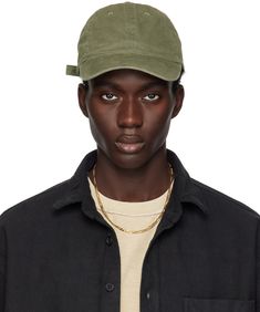 Cotton twill cap in khaki. · Curved brim · Embroidered eyelets at crown · Cinch fastening Supplier color: Washed olive Green Cap Outfit, Cap Outfit, Green Cap, John Elliott, Dad Cap, Dad Caps, Dad Hat, Dad Hats, Cotton Twill