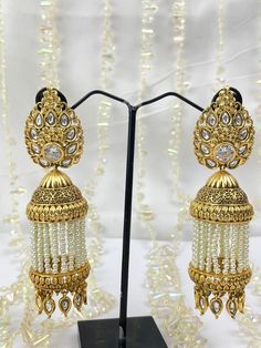 The epitome of traditional elegance and timeless beauty. These stunning earrings are crafted to be a standalone statement piece, designed to captivate and elevate your style to new heights. Whether you're attending a grand wedding, a lively party, or any special event, our Meena/Kundan Earrings will effortlessly complement your attire and make you the center of attention. Our Meena/Kundan Earrings are your go-to choice for all your special occasions. From weddings to parties, from cultural events to festivals, these earrings will elevate your style and make you shine wherever you go. They are the perfect accessory to make a lasting impression. Gold Bangles Indian, Bangles Indian, Kundan Earrings, Indian Earrings, Cultural Events, Gold Jewelry Indian, Kundan Jewellery, Gold Pattern, Indian Jewellery