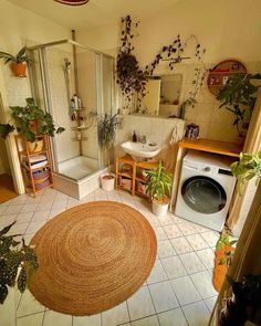 the bathroom is clean and ready to be used as a washer and dryer