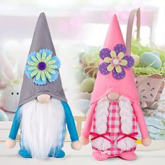 two stuffed gnomes sitting next to each other