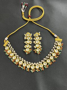 KUNDAN WEDDING BRIDAL NECKLACE CHOKER SET  Material :  HIGH quality GOLD plated brass, JADE, PEARL stones  Finish :  GOLD plated  Featuring :  LENGTH              ADJUSTABLE      Specility : 1. top RATED shop                    2. FREE delivery                    3. FAST delivery service                    4. lower PRICE from others                    5. HIGH quality products                    6. all jewelry items are made by HAND with                          LOVE and CARE                    7 White Festive Necklace For Marriage, Festive White Necklace For Marriage, Festive White Wedding Necklace, Kundan Necklaces For Marriage, White Kundan Necklaces For Marriage, Multicolor Gold Beaded Jewelry For Wedding, White Temple Jewelry Beaded Necklaces For Wedding, White Temple Jewelry Beaded Necklace For Wedding, Multicolor Beaded Necklaces For Wedding