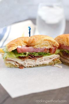 a sandwich cut in half sitting on top of a table