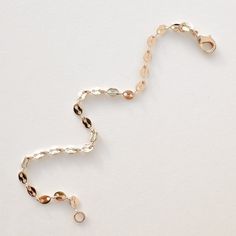 Compliment your bracelet stack with this dainty mariner style bracelet! Made with 18K 1/30 gold-filled chain, this is a bracelet that's easily stacked, or worn on its own. 18K 1/30 gold-filled bracelet 7 in. length chain Care instructions: With the proper care, gold-filled jewelry can last a very long time! Here are some handy tips for making sure that your jewelry shines as long as possible: While waterproof, remove your jewelry before swimming or hot tubs. Keep your jewelry away from lotion, p Dainty Gold Chain Bracelet With Oyster Style, 14k Gold Filled Rose Gold Jubilee Chain Bracelet, Gold Delicate Chain Bracelet With Lobster Clasp, Delicate Gold Chain Bracelet With Lobster Clasp, Dainty Gold-plated Chain Bracelet With Lobster Clasp, Rose Gold Bracelets With Lobster Clasp For Everyday Wear, Gold Chain Bracelet With Lobster Clasp, 14k Gold Filled, Everyday 14k Gold Chain Bracelet With Oyster Design, Dainty Gold Bracelet For Everyday