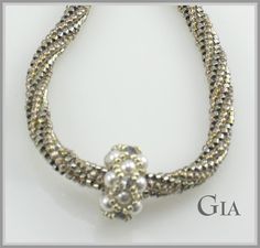 Gia is the perfect simple necklace that looks totally glamorous and can be worn on any occasion. Made with a twisted Herringbone rope and 3 - Right Angle Weave Beaded Beads. Swarovski Pearls and Crystals add the perfect touch of class.. The platinum look comes from some very beautiful silver gold iris/ palladium plated ab cylinder beads! The Kit which includes everything you need including needle and thread makes up to a 22 inch necklace. Now available in Mauve too. Mauve is shipping mid October Elegant Pearl Spacer Beads, Elegant Silver Beaded Necklaces With Gold Beads, Elegant Spiral Necklaces For Jewelry Making, Elegant Beaded Spiral Jewelry, Elegant Adjustable Beaded Necklaces With Spacer Beads, Weaving Necklace, Expensive Stones, Expensive Diamond, Right Angle Weave