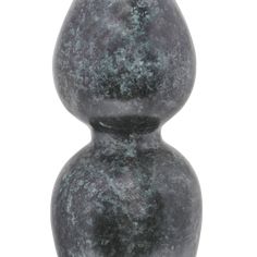 a large gray vase sitting on top of a white table