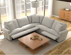 a living room with a sectional couch and coffee table