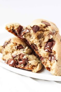 two chocolate chip cookies on a white plate