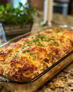 a casserole dish with meat and cheese in it sitting on a counter top