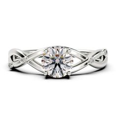 a white gold engagement ring with an intricate twist design on the shan shan shan shan shan shan