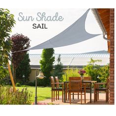 the sun shade sail can be used as an awning over a table and chairs