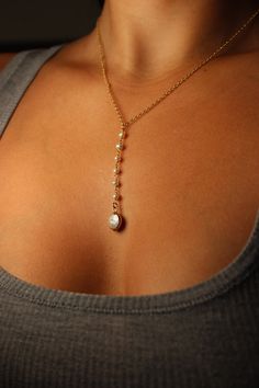 This exquisite Pasha Pearl Lariat is crafted in gold-filled stainless steel with a lariat drop of luscious keshi pearl finishing in a beautiful electroplated baroque pearl. Its 14-18” chain is adjustable for the perfect fit. Gold-filled components except for the big pearl, not recommended for water wear Luxury Pearl Chain Lariat Necklace As Gift, Luxury Lariat Pearl Necklace For Wedding, Luxury Handmade Lariat Jewelry, Luxury Traditional Lariat Jewelry, Luxury Pearl Chain Lariat Necklace, Luxury Lariat Pearl Drop Jewelry, Luxury Pearl Lariat Necklace With Pearl Chain, Luxury Lariat Jewelry With Pearl Pendant, Luxury Lariat Jewelry With Delicate Chain