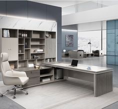 an office with a desk, chair and bookcases in the middle of it