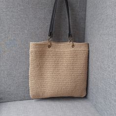 This is a high-quality beige crocheted bag, completely handmade. The bag is lined, this allows you to carry any items in it without fear that they might get caught inside. The shape and design of this bag combines boho and modern style. Two straps allow you to carry this bag with maximum comfort both on your shoulder and in your hands. Crochet gives the bag a soft, lightweight texture. It is easy to fold and fits easily into your luggage on your trips. A pleasant to the touch knitted bag is an e Casual Handmade Beige Bucket Bag, Large Capacity Beige Crochet Shoulder Bag, Beige Large Capacity Crochet Shoulder Bag, Beige Crochet Shoulder Bag With Large Capacity, Beige Woven Shoulder Bag For Shopping, Beige Jute Shoulder Bag With Large Capacity, Beige Large Capacity Jute Shoulder Bag, Beige Crochet Tote Bag With Large Capacity, Casual Beige Crochet Tote Bag