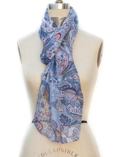 This Beautiful Scarf is a must have Color: Different shades of blue/gold/red/white Delicate paisley print Can be worn as a shawl, wrap or scarf Sheer lightweight fabric Fabric: 100% Polyester Measurement: 26"W x 70"L Wash Instructions: Hand wash or Dry clean Blue Bohemian Scarf With Paisley Print, Blue Bohemian Scarves With Floral Print, Blue Bohemian Paisley Print Scarves, Blue Paisley Print Bohemian Scarf, Different Shades Of Blue, Beautiful Scarf, Just Style, Scarf Poncho, Shawl Wrap