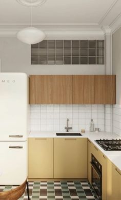 a kitchen with a checkered floor and wooden cabinets