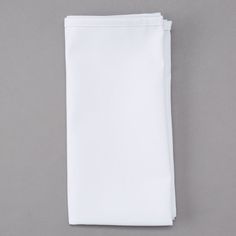 a plain white napkin on a gray background