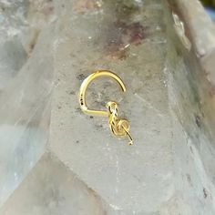 Nose stud, 14K solid yellow gold "G" clef Available in 20 or 18 gauge. Available as a nose ring, tragus or cartilage earring.Nose ring - "L" shape post, screw back left or screw back right post. Tragus earring - 9mm post with butterfly and silicone backings.Cartilage earring - 11mm post with butterfly and silicone backings."G" clef size: 2.7mm X 5.9mmThe perfect gift for you or your loved ones.It comes gift boxed and ready for giving!Follow us on:Instagram @sampsonjewelryFacebook @sampsonjewelry Yellow Gold Nose Rings With Prong Setting, Gold Hypoallergenic Nose Rings For Anniversary, Gold Septum Ring For Gifts, Gold Septum Ring For Anniversary, Gold Sterling Silver Septum Ring As Gift, 14k Gold Septum Ring With Prong Setting As Gift, Hypoallergenic Yellow Gold Nose Rings For Anniversary, Gold Hypoallergenic Septum Ring For Anniversary, Gold Internally Threaded Ring As Gift