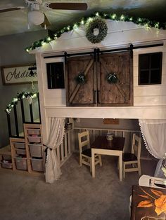 an overhead view of a living room with christmas lights on the ceiling and decorations around it