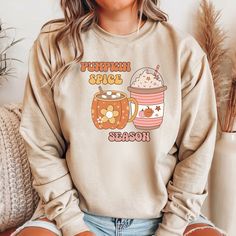 Get cozy this autumn with our Fall Coffee Sweatshirt! Perfect for celebrating your favorite fall flavor, this comfy and stylish sweatshirt is a must-have for the cooler months. Whether you're sipping on a hot coco, enjoying a crisp walk, or just lounging at home, this sweatshirt will keep you warm and fashionable. This Fall Coffee Sweatshirt makes an excellent gift for family, friends, or anyone who loves autumn. It's ideal for birthdays, special occasions, or just because. Show your love for al Cute Cozy Fit Tops For Fall, Cute Fall Loungewear Sweatshirt, Cute Relaxed Fit Sweatshirt For Fall, Pumpkin Sweater, Pumpkin Spice Shirt, Teacher Sweatshirt, Coffee Tees, Coffee Sweatshirt, Hot Coco