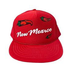 super sick vintage 80s red new mexico trucker hat  red trucker hat/cap with padded front and funky New Mexico printed graphic with little chiles  back of hat is red mesh with adjustable strap  tag says Nissin Made in Philippines Nissin Cap Red Retro Trucker Hat With Short Brim, Classic Red Trucker Hat, New Mexico Chili, Retro Red Trucker Hat, Novelty Red Trucker Hat, Vintage Red Snapback Hat, New Mexico, Trucker Cap, Hats For Men