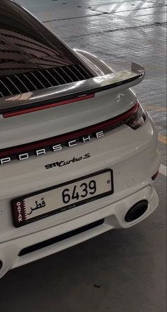 the back end of a white porsche