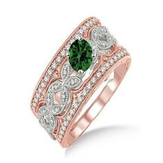 a rose gold ring with green and white diamonds