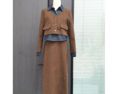 Item No. SZ125 Material: Corduroy Color: Brown US Size: XS, S, M, L, XL, 1XL - Handcrafted. - Skirt Set. - Denim Block. - Midi Length. - Collared. - Button Front. - Long Sleeve. - Elastic Waist. - Made ethically with a lot of love and care. Brown Buttoned Skirt For Winter, Skirt Top Set, Midi Skirt Set, Button Front Skirt, Womens Suits, Winter Skirt, Set Women, Skirt Top, Midi Length