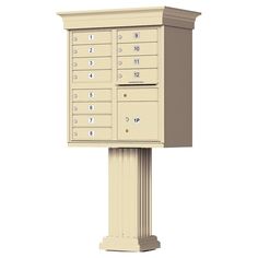 a white mailbox sitting on top of a pedestal