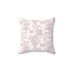 a pink and white pillow with an animal print on the front, sitting on a white background