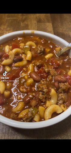 a white bowl filled with chili and beans