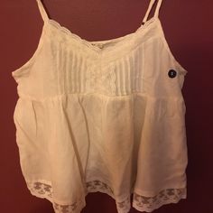 Super Soft And Flirty Beige Top. Pretty Lace At Neckline And Bottom. Loose Fitting. Measures 12” From Armpit To Bottom Of Lace. Semi-Sheer. 100% Viscose. Casual Tank Camisole With Lace Trim, Lace Camisole For The Beach, Lace Cami Camisole For The Beach, Lace Camisole With Spaghetti Straps For The Beach, Casual Tank Top With Lace And Spaghetti Straps, Casual Lace Camisole Tank Top, Casual Lace Tank Top For Vacation, Lace Tank Top With Spaghetti Straps For Beach, Lace Spaghetti Strap Tank Top For Beach