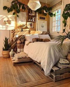 a bed room with a neatly made bed and lots of plants