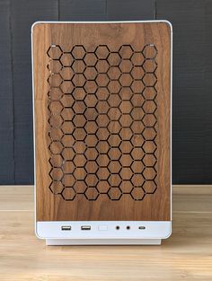 a wooden speaker sitting on top of a table