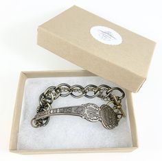 an antique key bracelet in a box