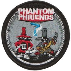 a patch with an image of two cartoon characters on it, and the words phantom