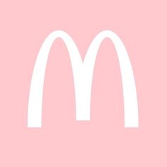 a white mcdonalds logo on a pink background