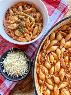 two bowls of pasta, one with meat and the other with cheese