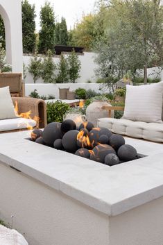 a fire pit sitting on top of a cement slab