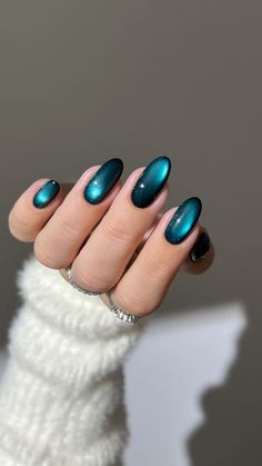 Aistė Haas on Instagram: "🧊 currently defrosting my holiday nail polish collection ❄️  *all the products used are linked on my amzn in the bio  _____ *affiliate #winternails #glitternails #marblenails #bluenails #nails #nailinspo #nailtutorials #diynails #cateyenails blue green teal nails aura ombre glass nails, almond nails, simple classy  velvet fall nails" Velvet Nails Blue, Teal Holiday Nails, Teal Aura Nails, Dark Teal Nail Ideas, Blue And Teal Nails, Teal Cat Eye Nails, Green Teal Nails, Glass Effect Nails, Teal Winter Nails