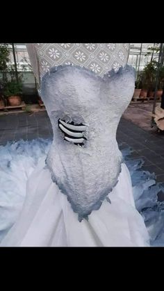 a white wedding dress with black and white accents