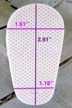 a close up of a white surfboard with measurements